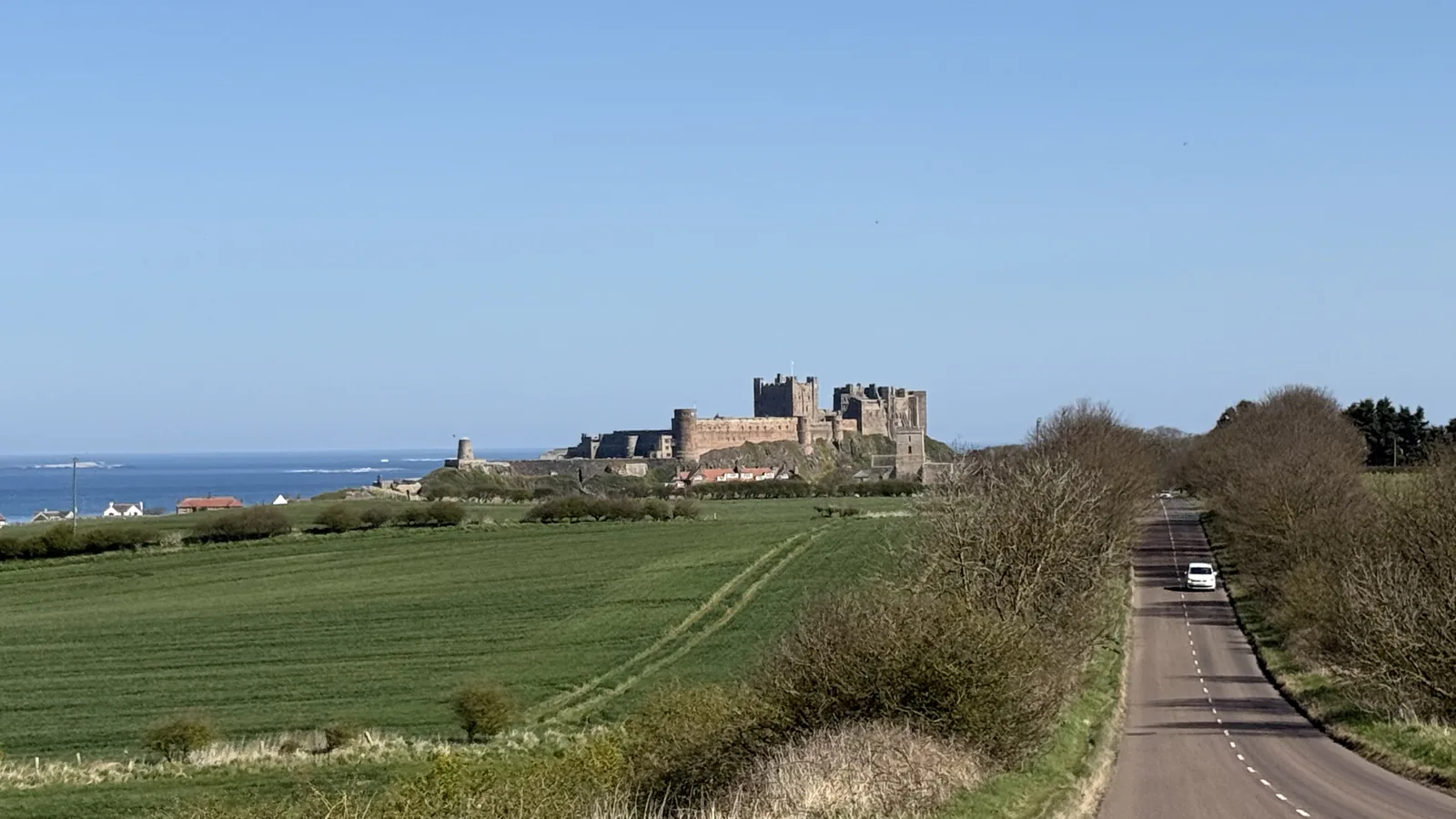 Bamburgh Castle seen from the coastal road