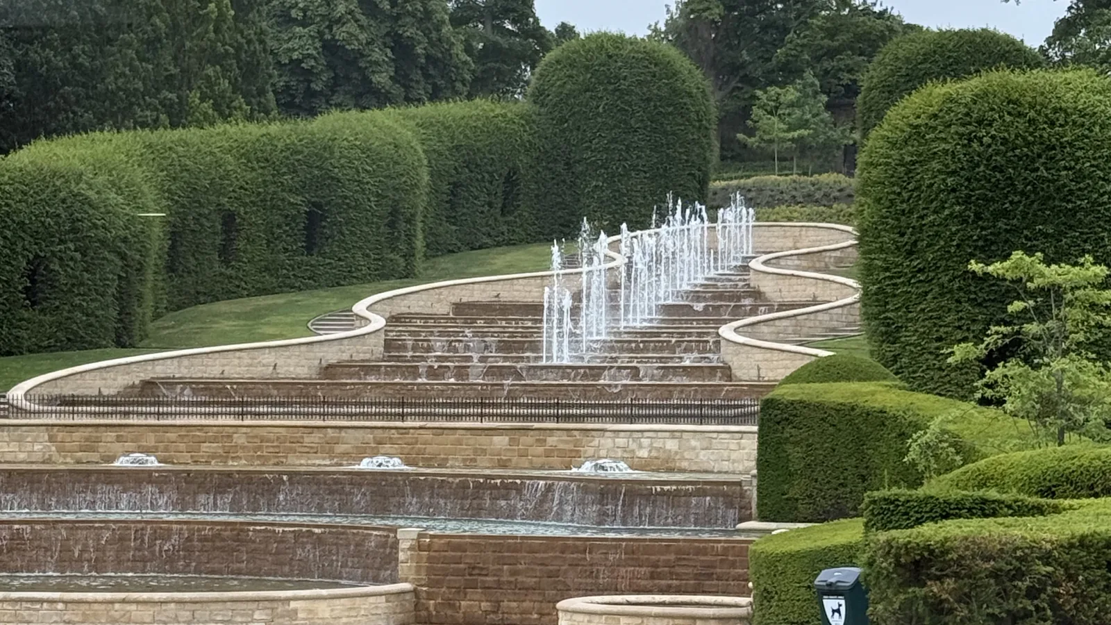Formal gardens with hedges and water feature